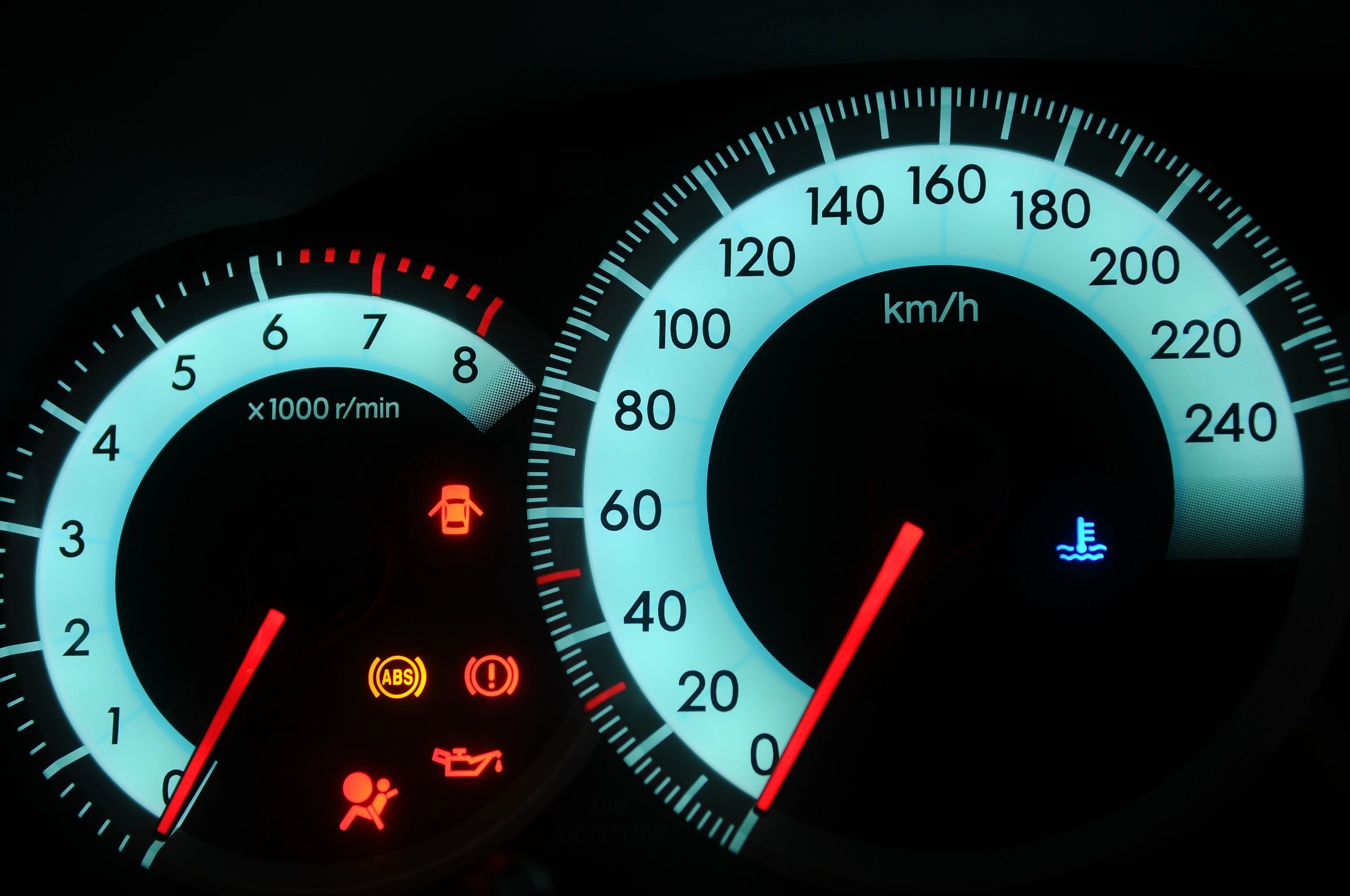 Car dashboard instrument cluster with warning indicators