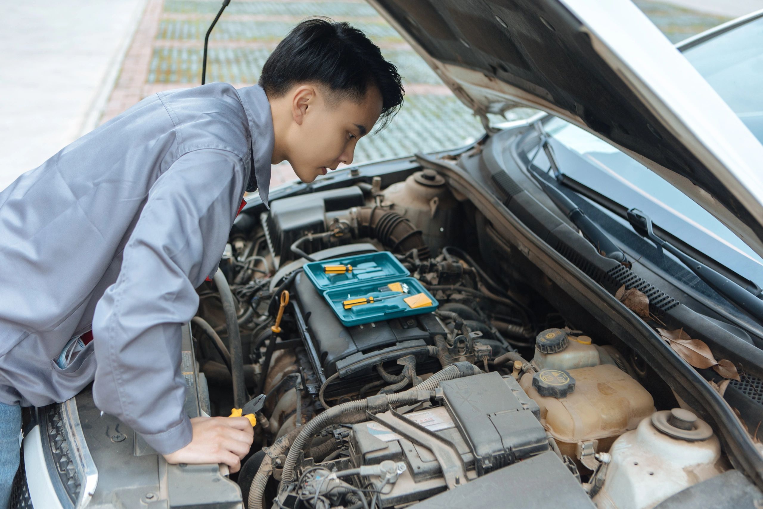 Mechanic inspecting a vehicle