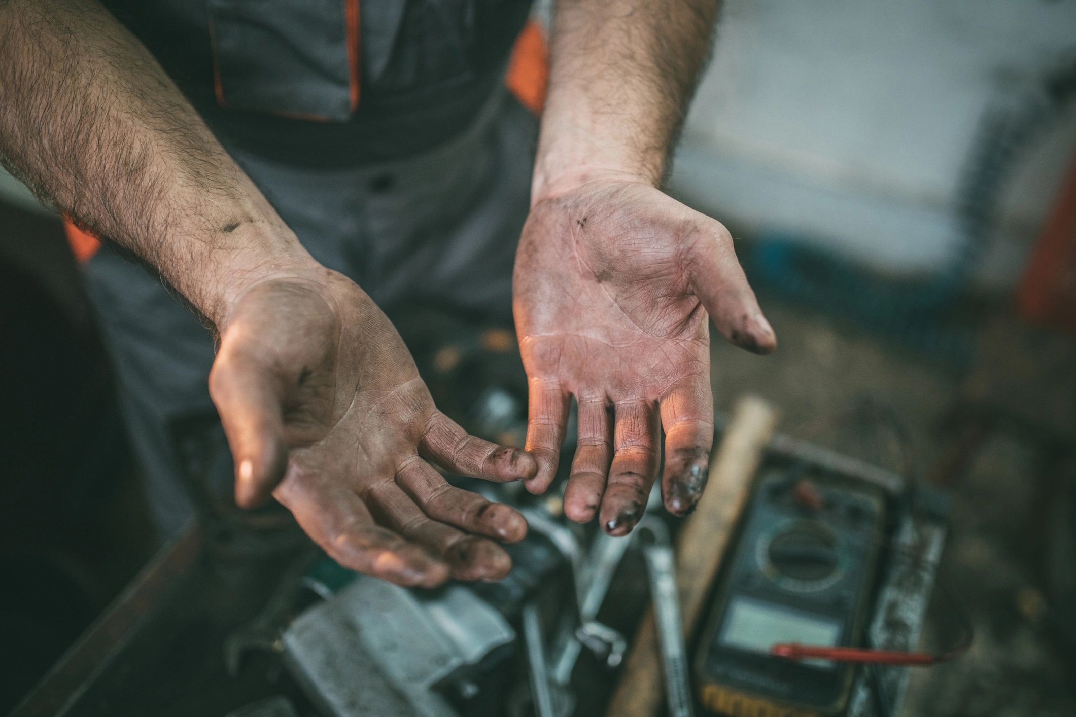 Mechanic hands handling automotive components during service